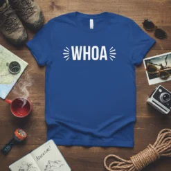 Blue t-shirt with "WHOA" in white text, surrounded by radiating lines. Design is for adventure lovers