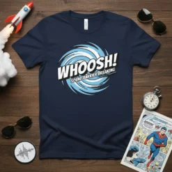 WHOOSH! SOUND BARRIER BREAKING comic style graphic on a navy t-shirt with swirling blue lines