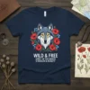 Wolf head with poppies and text "WILD & FREE SPIRIT OF THE NORTH STRENGTH & BEAUTY" on a navy blue