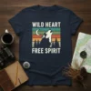 Wild Heart Free Spirit t-shirt design with a howling wolf, moon, pine trees, and retro sunset stripes