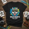 WILD HEARTS PARTY PAWS EST. 2024 text with a cool wolf wearing sunglasses on a black t-shirt graphic