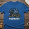 WILD INSTINCT t-shirt featuring a stylized leopard with radiating lines, in blue, black, and gold