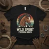 Wild Spirit Freedom Rides text with a horse head graphic and mountain sunset on a black t-shirt