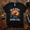 Black t-shirt with "Wild Spirit Nature's Call" text, featuring a wolf silhouette against a large orange moon and pine trees
