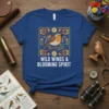 T-shirt featuring the phrase "WILD WINGS & BLOOMING SPIRIT" with a robin on a branch surrounded by folk-style flowers
