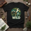 Black t-shirt with a geometric WILD wolf graphic, mountains, trees, and stars. Primary keyword: WILD wolf graphic t-shirt