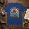 Wilder Than The West cowboy riding a horse silhouette graphic tee with mountains and sunset