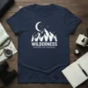 Navy blue t-shirt with white "WILDERNESS EXPLORE THE UNKNOWN" text and a mountain, moon, and star graphic