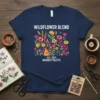 Navy blue t-shirt with "WILDFLOWER BLEND EST. 2023 NATURE'S PALETTE" text and colorful floral illustration