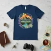 Wildflowers of Oregon t-shirt design featuring mountains, river, and floral wreath with text "Wildflowers of Oregon"