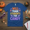 Blue t-shirt with "WILL TRADE STUDENTS FOR CANDY" text in orange, white, yellow, and purple, featuring Halloween graphics like bats