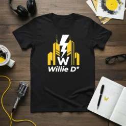 Black t-shirt featuring the bold white text "Willie D*" below a graphic of yellow buildings and a white lightning bolt