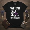 Witch on broom t-shirt design with white text "WITCH ON BROOM" and a purple witch silhouette flying across a crescent