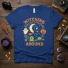 Witching Around Halloween T-Shirt featuring a witch on a broom, ghost, pumpkin, and monsters with "Witching Around" text