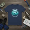 With Las Save The Oceans t-shirt featuring scuba divers, sea turtles, and fish in an underwater scene, promoting ocean conservation