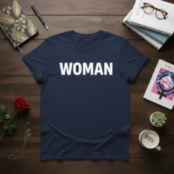 Navy blue t-shirt with bold white text 'WOMAN' centered on the chest