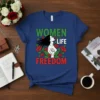 WOMEN LIFE FREEDOM text with a woman's profile, fist raised, surrounded by red roses, on a dark blue t-shirt