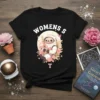Womens S T astronaut sloth design with flowers and stars on a black t-shirt, suitable for space enthusiasts