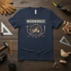 Navy t-shirt with "WOODWORKER" text and circular graphic of saw, logs, hammer, and chisels