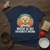 Woof Is My Favorite Word t-shirt with a smiling golden retriever graphic and retro sunset background
