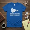 Blue t-shirt with white text "World's Okayest Neuropsychologist" and a graphic of a brain wearing a crown