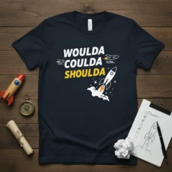 Black t-shirt with "WOULDA COULDA SHOULDA" text and rocket ship graphics, inspiring action and achievement