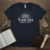 Navy t-shirt with white text "YAHUSHA KING OF KINGS" and a crown graphic, symbolizing faith and royalty