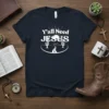 Christian T-Shirt with "Y'all Need JESUS" text, desert landscape, sun, and cacti graphics