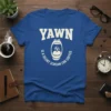 Blue t-shirt with "YAWN IS A SILENT SCREAM FOR COFFEE" text and a graphic of a yawning mouth