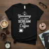 Black t-shirt with white text "Yawning is a silent SCREAM for Coffee" and a coffee cup graphic