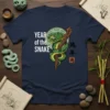 Year of the Snake t-shirt design featuring a green coiled snake on a branch with Chinese characters, white text