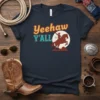 Yeehaw Y'ALL retro western t-shirt design with a cowboy riding a horse at sunset graphic