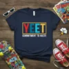 Navy blue t-shirt with "YEET COMMITMENT TO HASTE" text in colorful block letters, featuring a yellow border