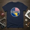 Navy t-shirt with "YES, I'M BOTH OF THEM" text and circular design split between USA and Bosnia flags