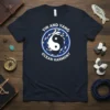 Yin and Yang Ocean Harmony t-shirt with a circular design of fish surrounding a classic yin yang symbol