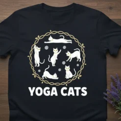 Black t-shirt featuring white cats in various yoga poses arranged in a circular pattern with the text "YOGA CATS" below