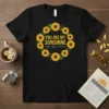 Black t-shirt with "YOU ARE MY SUNSHINE my only sunshine" quote inside a sunflower wreath design