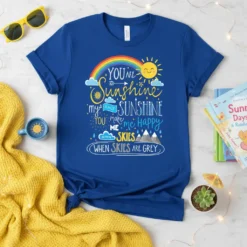 Blue t-shirt with "YOU ARE SUNSHINE my ONLY SUNSHINE you MAKE me HAPPY WHEN SKIES ARE GREY" quote and rainbow