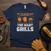 Navy t-shirt with "YOU CAN NEVER HAVE TOO MANY GRILLS" text and illustrations of three different grills