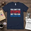 Political statement t-shirt with text "YOU CAN'T FIX STUPID BUT YOU CAN IMPEACH HIM" in bold red and blue letters