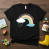 You Can't Have A Rainbow Without A Little Rain quote t-shirt with a colorful rainbow and rain cloud graphic