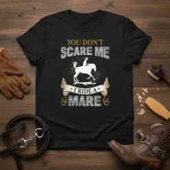 "You Don't Scare Me I Ride A Mare" text with a horse rider graphic on a black t-shirt