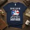 T-shirt featuring the text "YOU DON'T SCARE ME I WAS RAISED BY A Puerto Rican MOTHER" with a portrait and