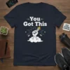 You Got This inspirational quote t-shirt with a fist holding a flaming torch graphic