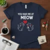 You Had Me At Meow text with two cute cats holding a yarn heart on a navy t-shirt design