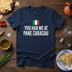 Navy t-shirt with white text "YOU HAD ME AT PANE CARASAU" and an Italian flag above it