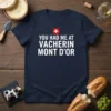 Navy t-shirt with white text "YOU HAD ME AT VACHERIN MONT D'OR" and a Swiss flag graphic above