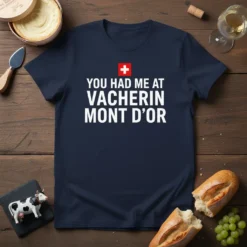 Navy t-shirt with white text "YOU HAD ME AT VACHERIN MONT D'OR" and a Swiss flag graphic above