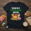 T-shirt with "You Had Me At Vegan Junk Food" text and cartoon graphics of a burger, fries, donut, and ice