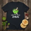 T-shirt with "You Had Me At Zhug" text and a mortar with ingredients for zhug sauce, including chilies and herbs